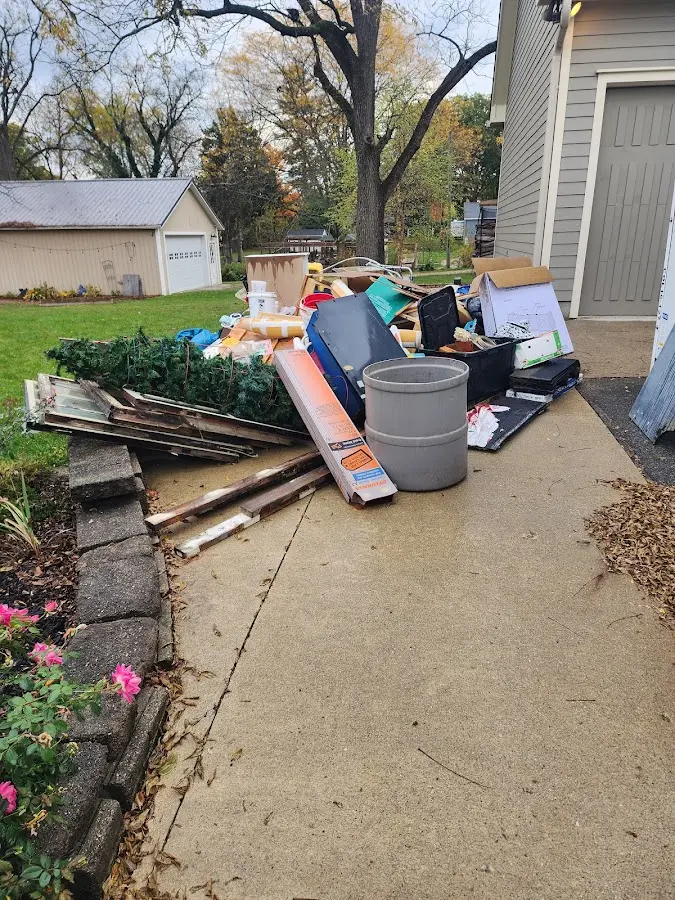 Dumpster being loaded with debris for Demolition Dumpster Rental in Copake